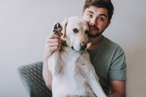 istock Pleasant bearded man sitting with his dog 1095983622