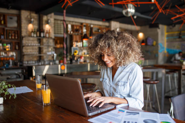 istock Focused young African woman working online in a cafe 1095985160