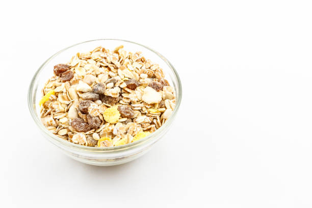 istock Muesli  in glass bowl on white background 1095986164
