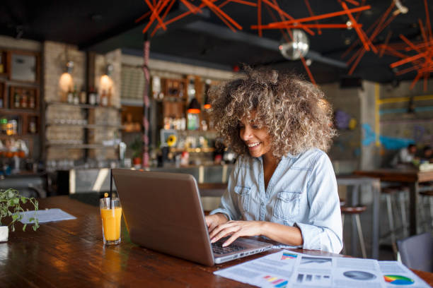 istock Focused young African woman working online in a cafe 1095986180