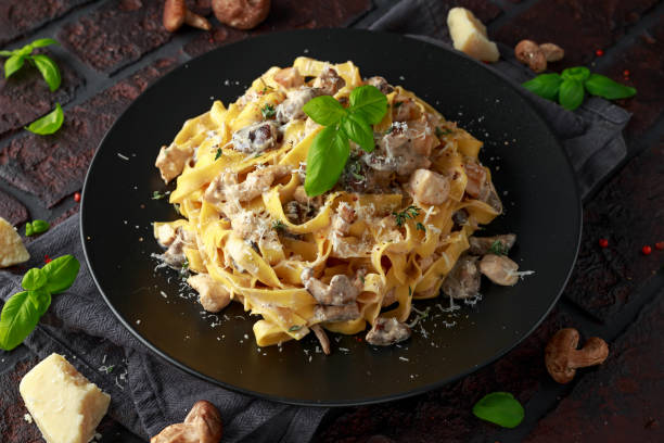 istock Pasta with shiitake mushrooms and chicken with herbs and cheese 1095986398