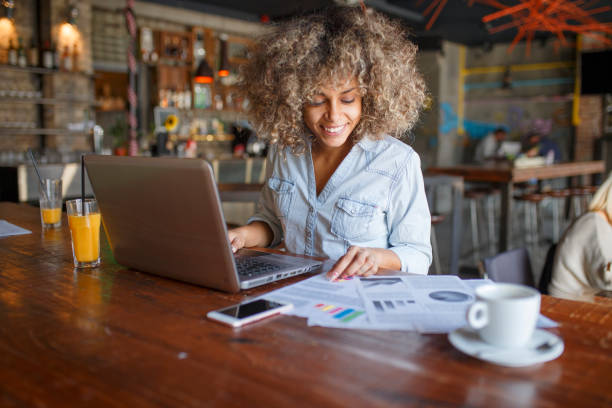 istock Focused young African woman working online in a cafe 1095987110