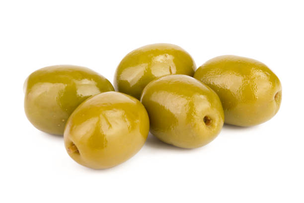 istock Green olives isolated on a white background 1095990038