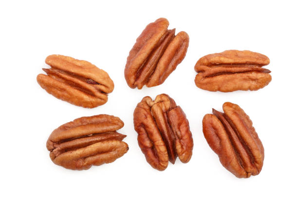 istock pecan nut isolated on white background. Top view. Flat lay 1095990084