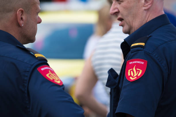 closeup of two firefighters stock photo
