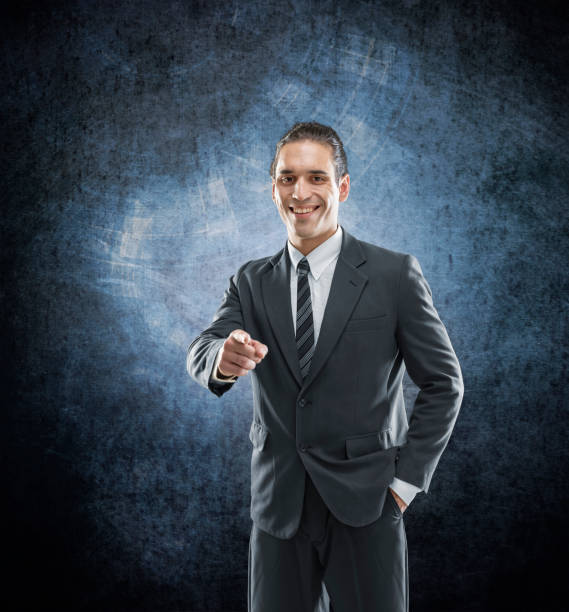 istock Businessman in suit pointing finger at you 1095993732
