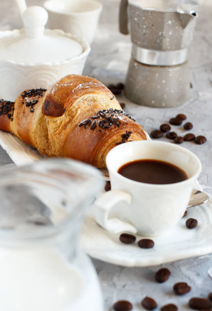 istock Breakfast with coffee and croissant 1095995392