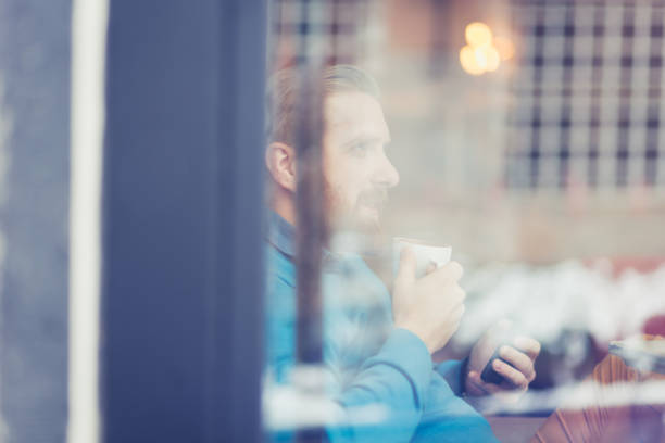 istock Young, redhead businessman enjoying coffee break at cafe 1095995696