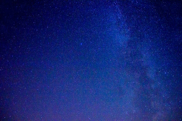 istock Night starry sky and star tracks 1095997398