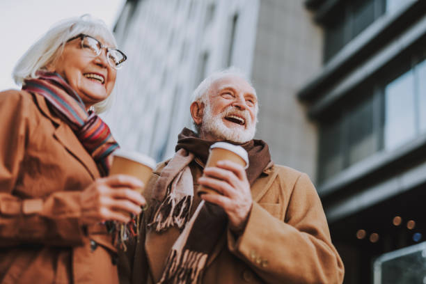 istock Happy senior couple with hot drinks spending time outdoors 1096001888