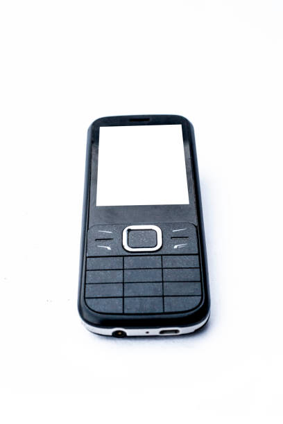 istock Black colored Mobile phone or cell phone or keypad cell phone or keypad mobile phone isolated on white. 1096005392