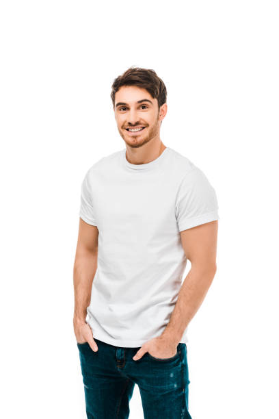 istock handsome happy young man standing with hands in pockets and smiling at camera isolated on white 1096007998