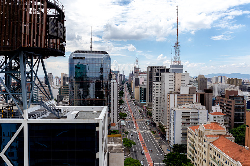 Sao Paulo, Brazil - January 16 2019: View of Sao Paulo's Avenida Paulista from the top of Sesc Paulista, cloud sky day