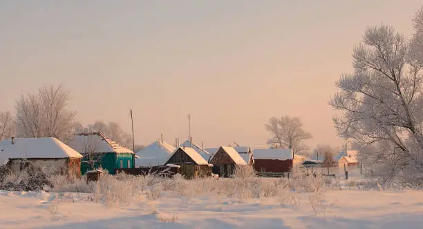winter view of traditional wooden houses in Russia