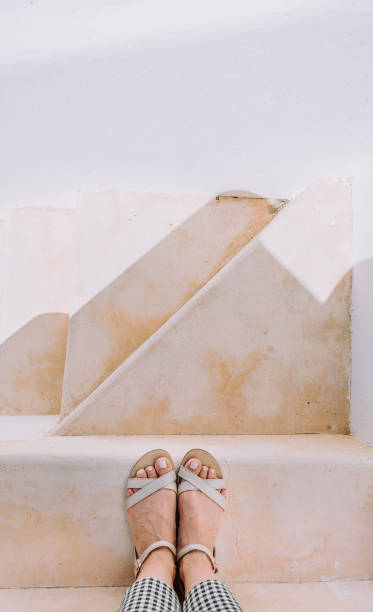 istock legs woman sandals near steps diagonal line 1096012724