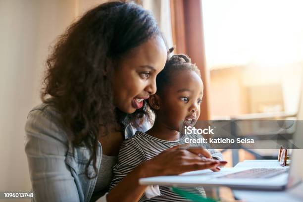 The Internet Is Just What A Curious Mind Needs Stock Photo - Download Image Now - Child, Mother, Laptop