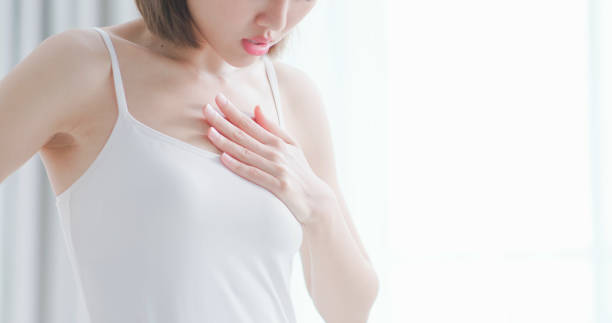 woman suffer from heart attack stock photo
