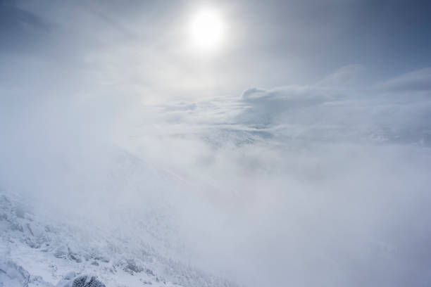 istock Clouds cover the snow-capped mountains 1096015714