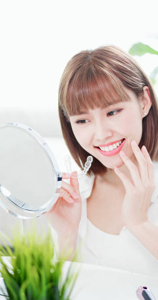 istock woman with teeth invisible brace 1096016160