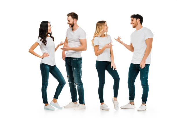 istock full length view of young couples standing and talking isolated on white 1096019110