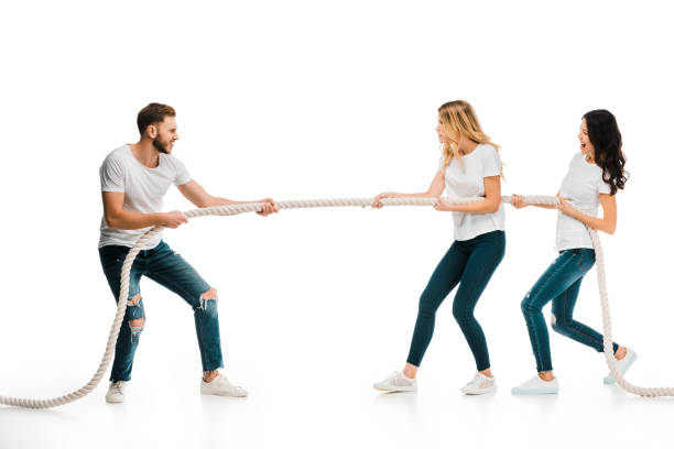 istock emotional young man and women pulling rope isolated on white 1096019180