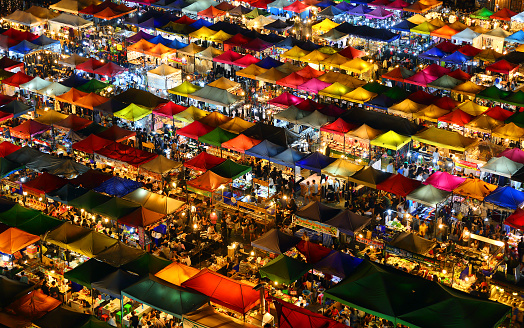 High view of colorful tent retail shop with night light at Talad Rod Fai Night Market, Ratchada, Bangkok, Thailand