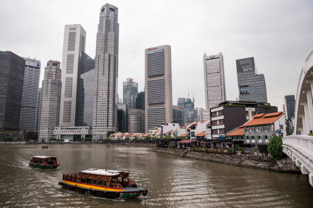 istock Singapore Marina Bay Skyline with ferries and river daytime 1096020556