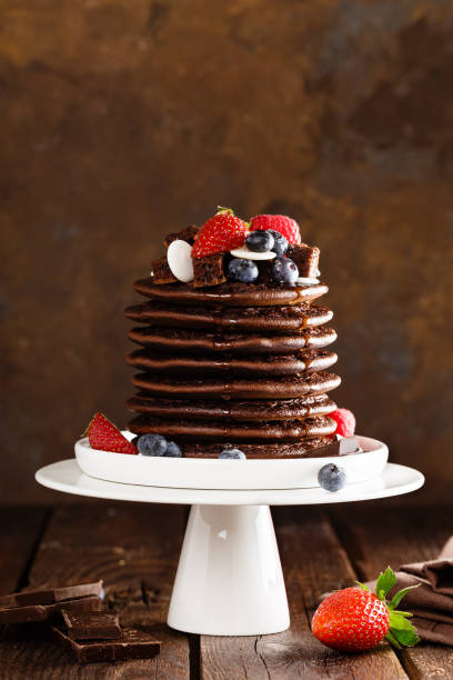 istock Stack of chocolate pancakes with berries, strawberry, raspberry and blueberry 1096021108