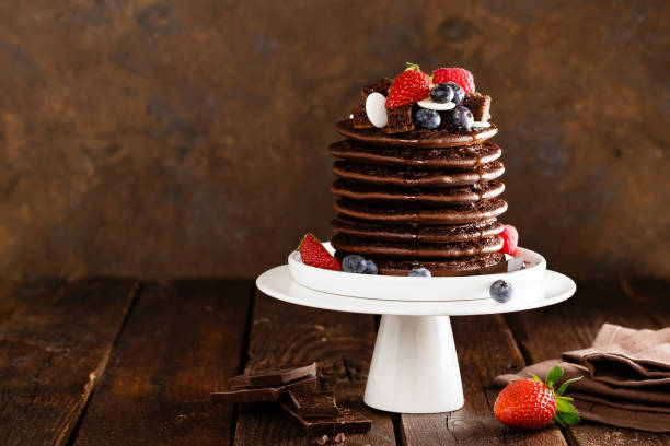istock Stack of chocolate pancakes with berries, strawberry, raspberry and blueberry 1096021410
