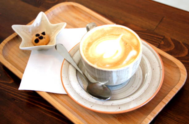 istock coffee cup with heart shape and sweet little cake 1096023230