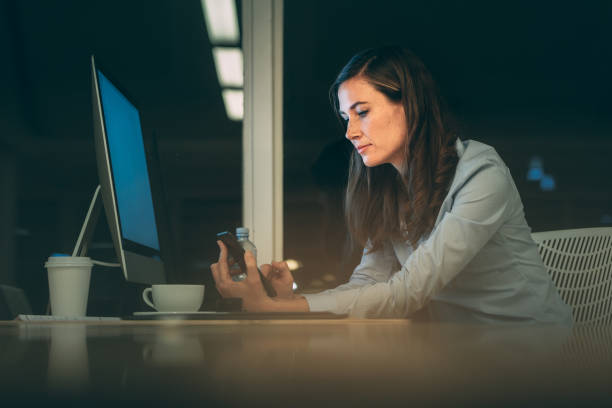 istock Businesswoman working late night in office 1096023534