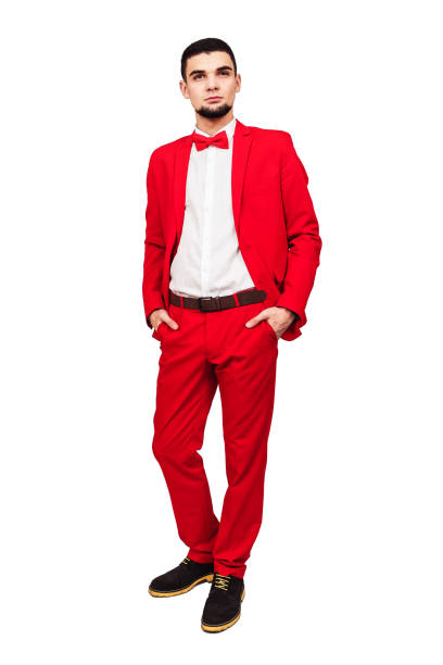 istock confident young handsome. bearded man in red suit posing on white background 1096024292