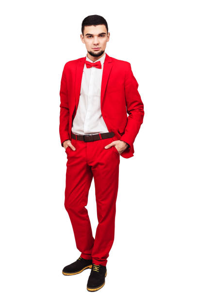 istock confident young handsome. bearded man in red suit posing on white background 1096024300