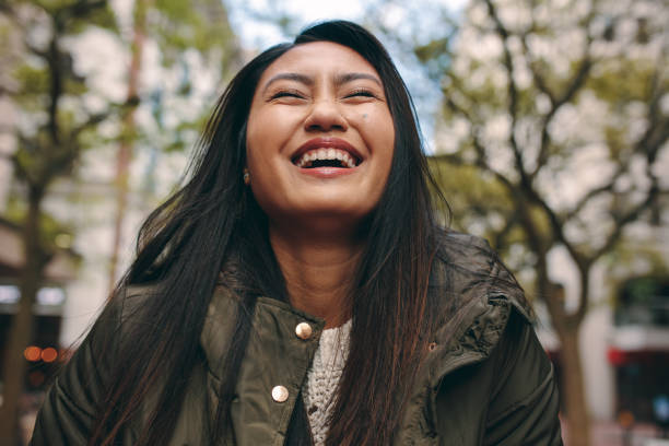 istock Woman smiling with eyes closed 1096027200