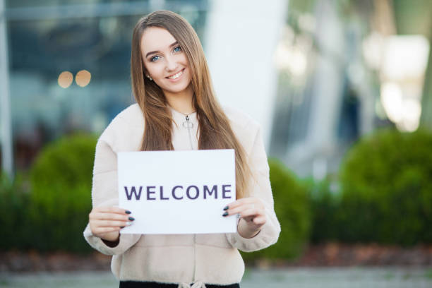 istock Women business with the poster with welcome message 1096029150
