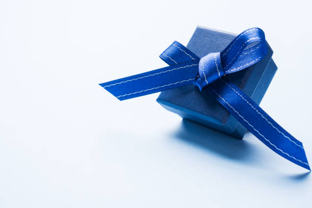 istock Present blue box on light background greeting card holidays concept. Copy space 1096033624
