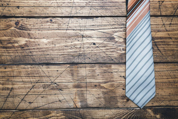 istock Father's Day Concept. Striped tie on wooden background with copy space. 1096035488