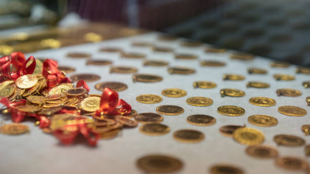 istock Gold coins standing on the shelf 1096035952