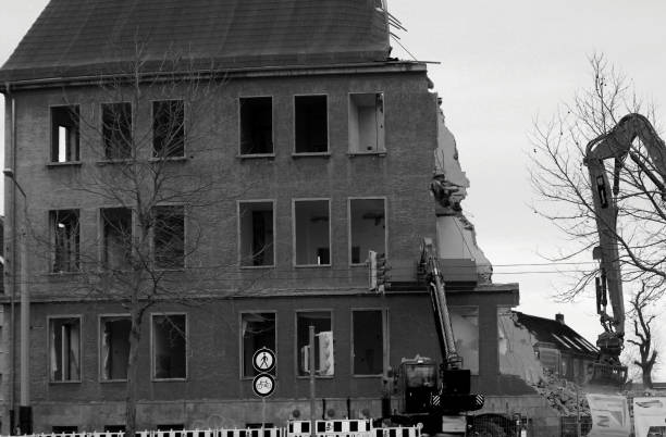 istock Demolition work old building with excavator in black white 1096037544