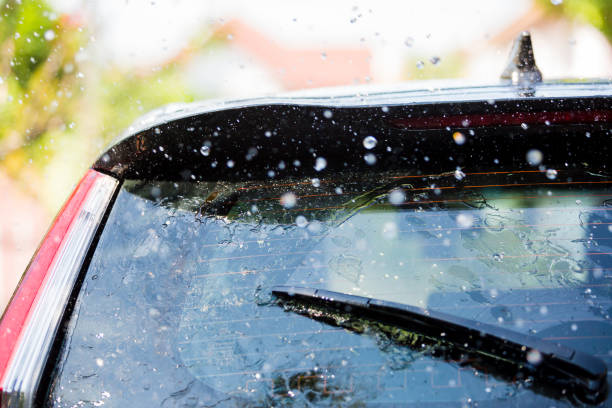 istock The wiper on rear window of a car with drop rain 1096039162