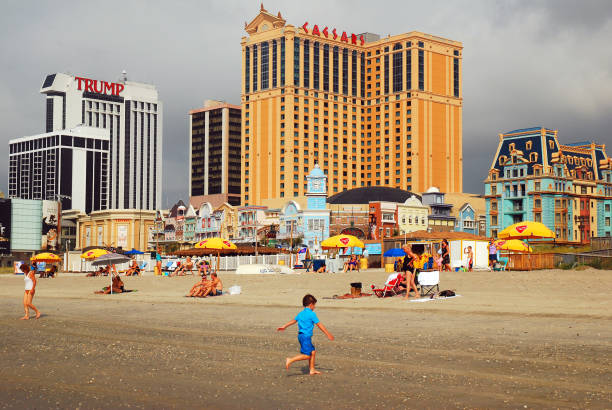 Atlantic City, NJ, USA August 16, 2010 Families relax and play at the beach fronting the casinos of Atlantic City, New Jersey
