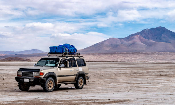 Jeep on salt flats stock photo