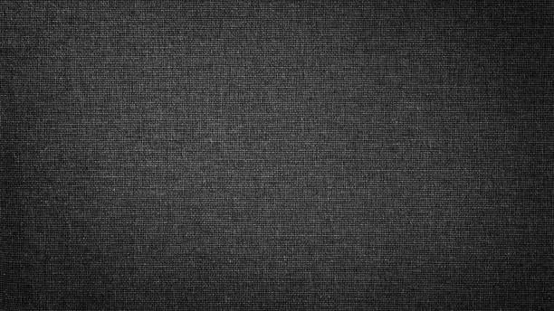 Photo of Dark black white linen canvas. The background image, texture.