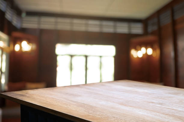 istock wooden table with blurred modern home background 1096048038