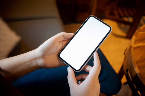 istock hands of woman holding empty white screen mobile phone 1096048110