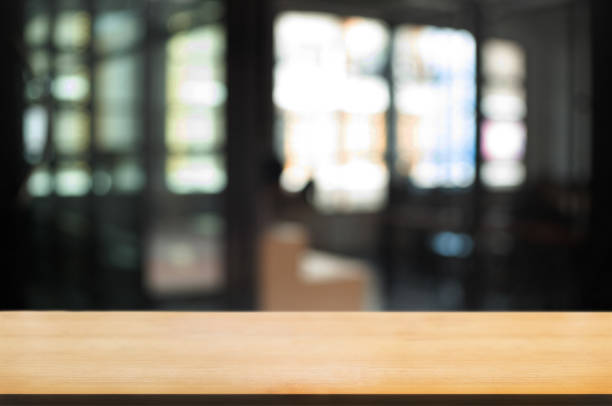 istock empty wood table with blur montage coffee shop cafe background 1096048190