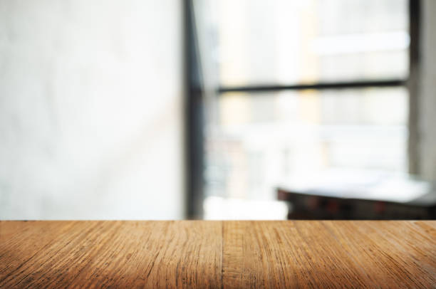 istock empty wood table with blur montage coffee shop cafe background 1096048192