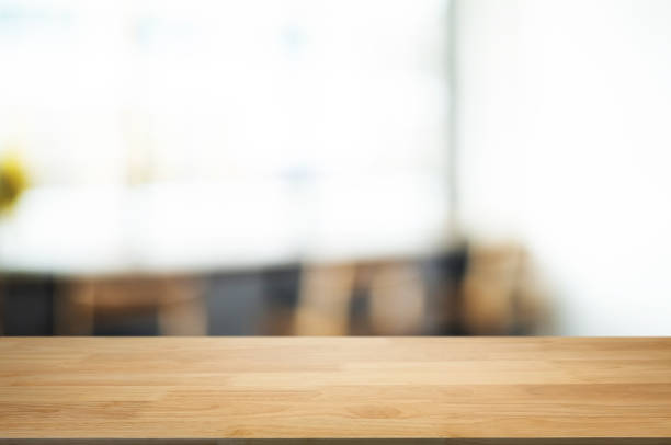 istock empty wood table with blur montage coffee shop cafe background 1096048200