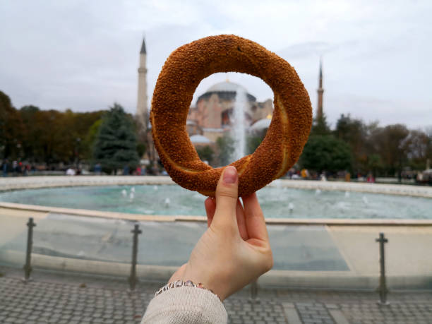 istock Simit  turkish bagel in the Sultan Ahmed square viewed Hagia sophia 1096049030