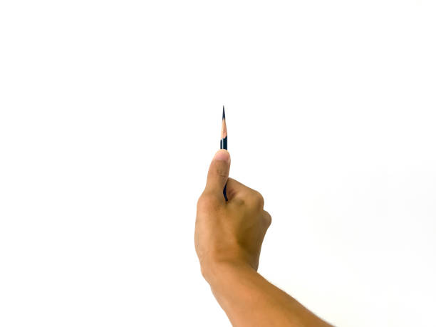 istock A man hand holding a very sharp pencil with his thumb in isolated white background. 1096052368